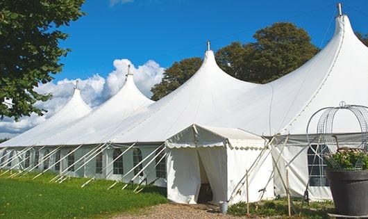 a group of luxury portable restrooms with individual stalls and running water in Royal City